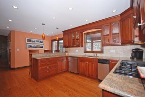 Renovated Kitchen with cherry cabinets, granite countertops, stainless appliances and gorgeous hardwood floors